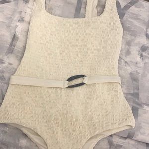 White, belted one piece